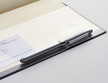 A cover with a pen-holder