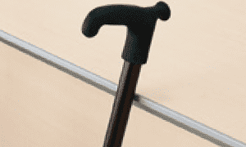 A walking stick rests securely on the edge.